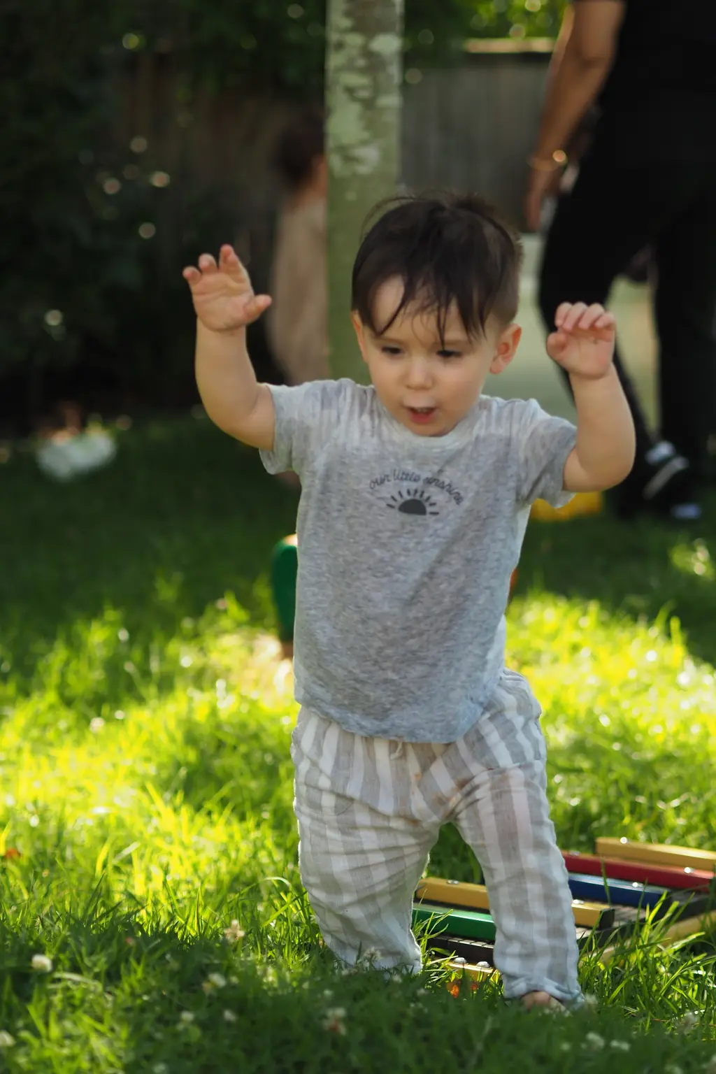 Two toddlers playing together outdoors