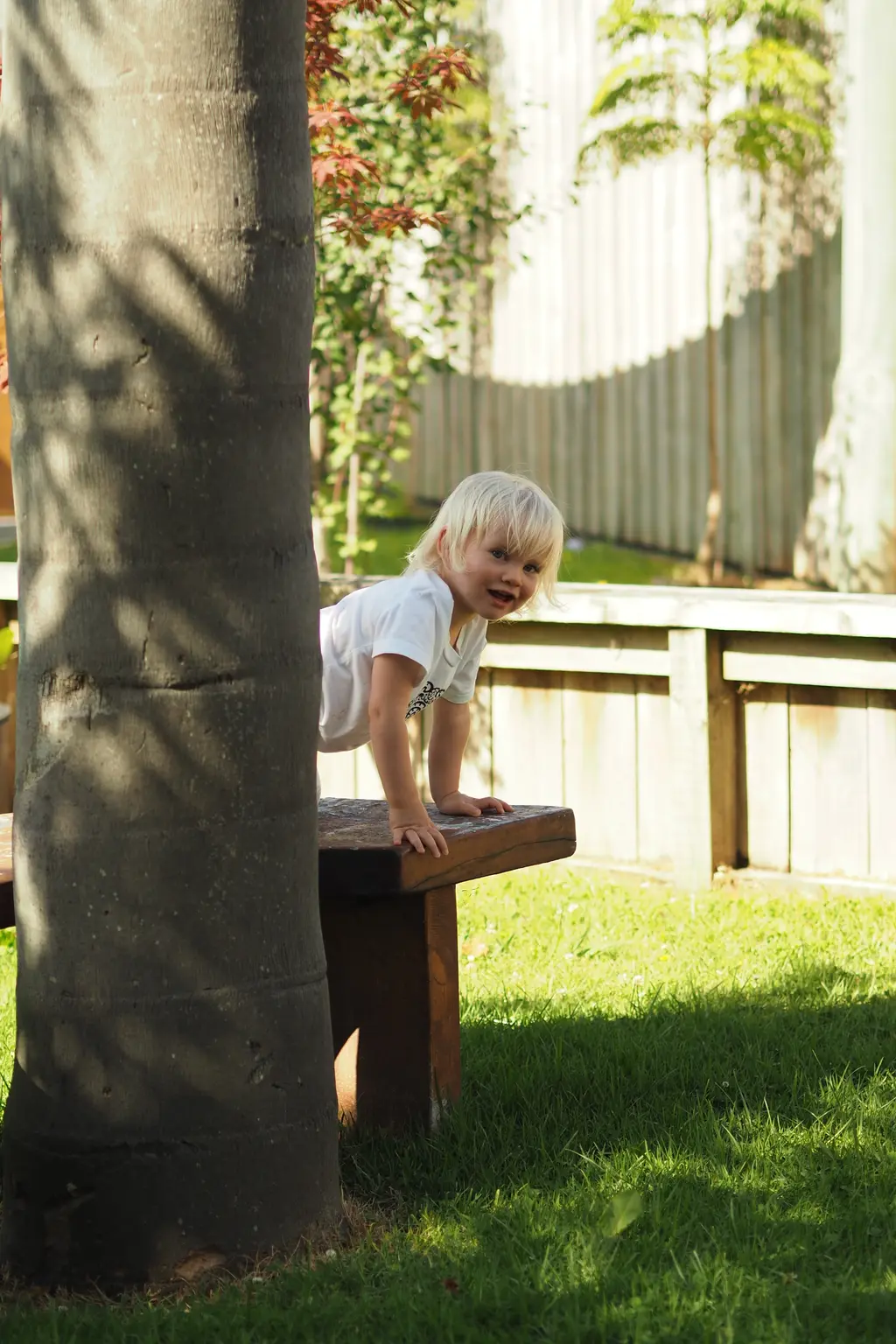 Child walking through the outdoor play area