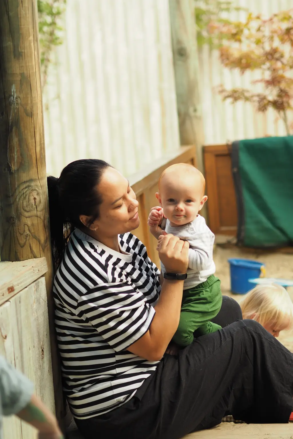Kaiako caring for a baby