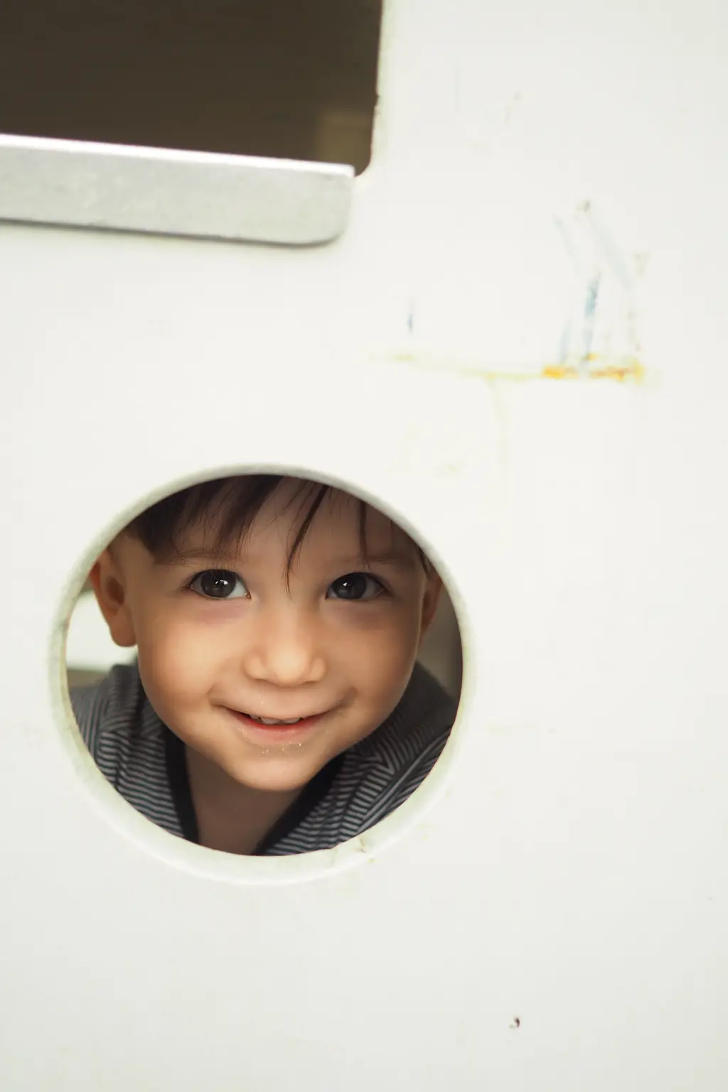 Child engaged in indoor play