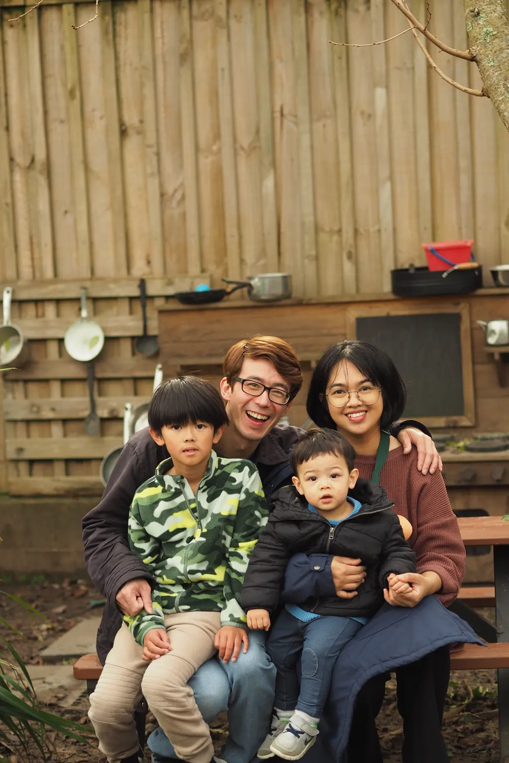 Whānau gathered together in the centre garden