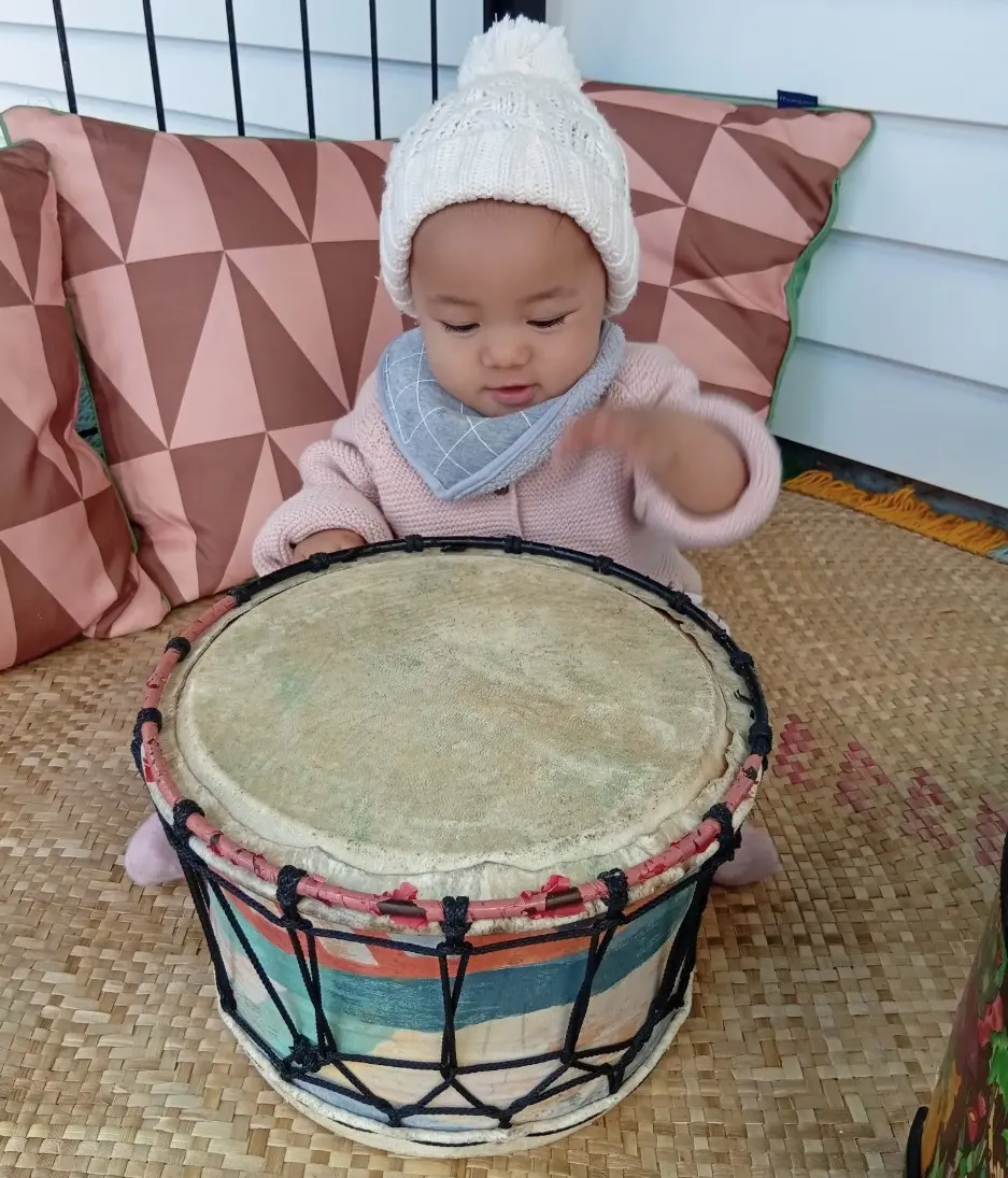 Child smiling during cultural dress-up play